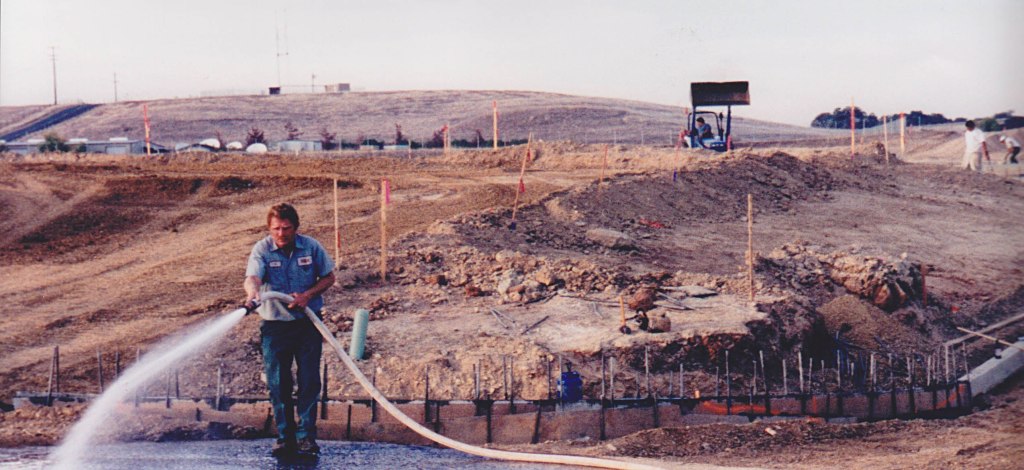Man hosing a construction site.